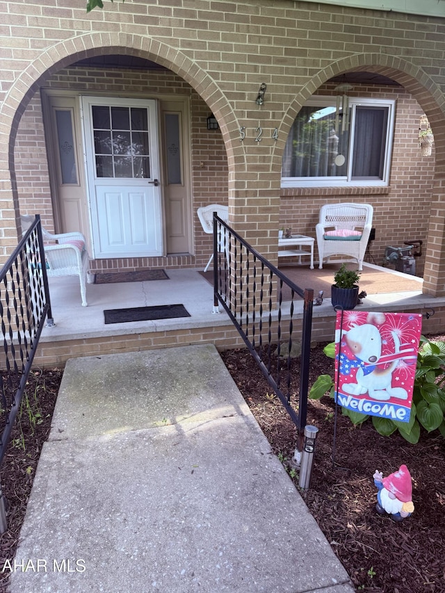 524 Elm Ln, Duncansville, PA 16635 - property entrance with brick siding and covered porch