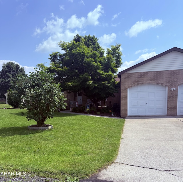 524 Elm Ln, Duncansville, PA 16635 - view of front of home with brick siding, a front yard, a garage, and concrete driveway