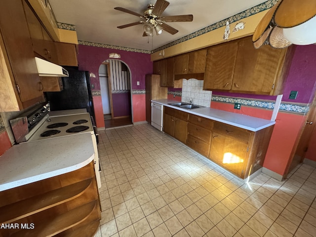 kitchen with ceiling fan, sink, backsplash, white appliances, and exhaust hood