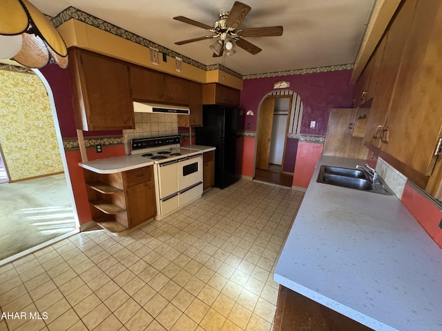 kitchen with decorative backsplash, white appliances, ceiling fan, and sink