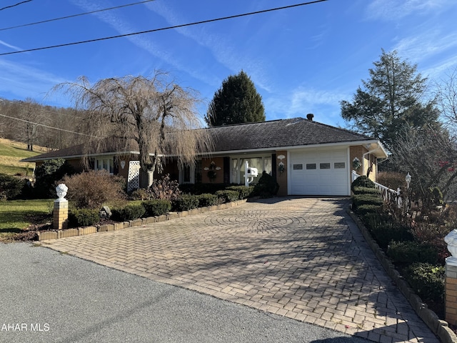 single story home featuring a garage