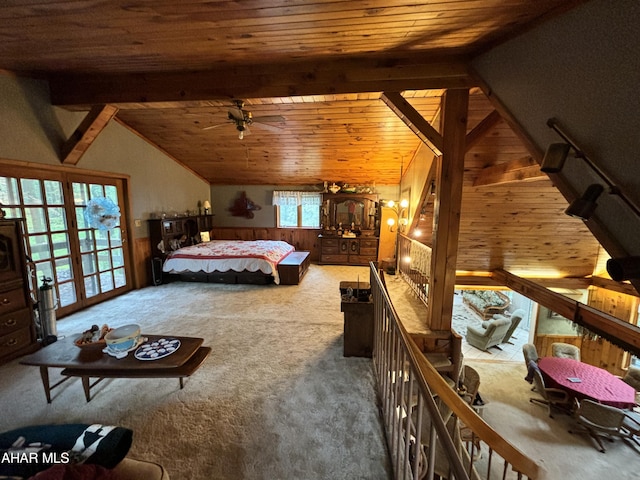 bedroom featuring carpet, vaulted ceiling with beams, wood ceiling, and wooden walls