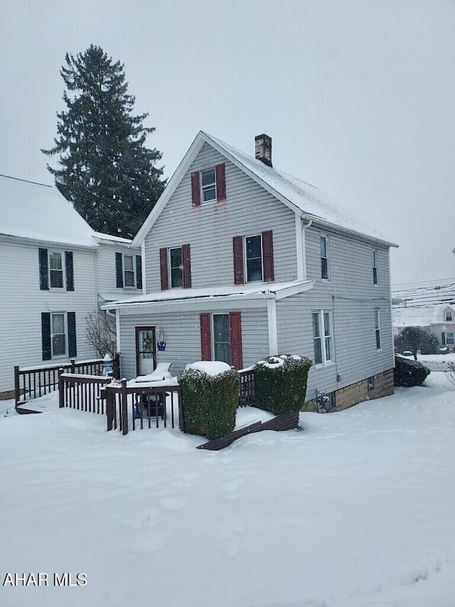 view of snow covered property