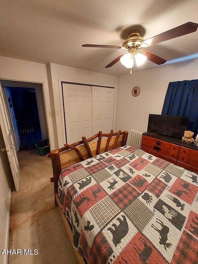 bedroom featuring ceiling fan, carpet, and a closet