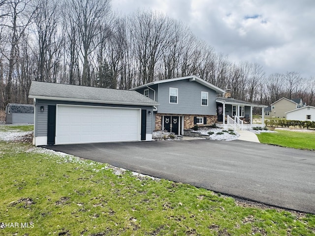 895 Coach Rd, Cresson, PA 16630 - split level home with a front yard, an attached garage, and driveway