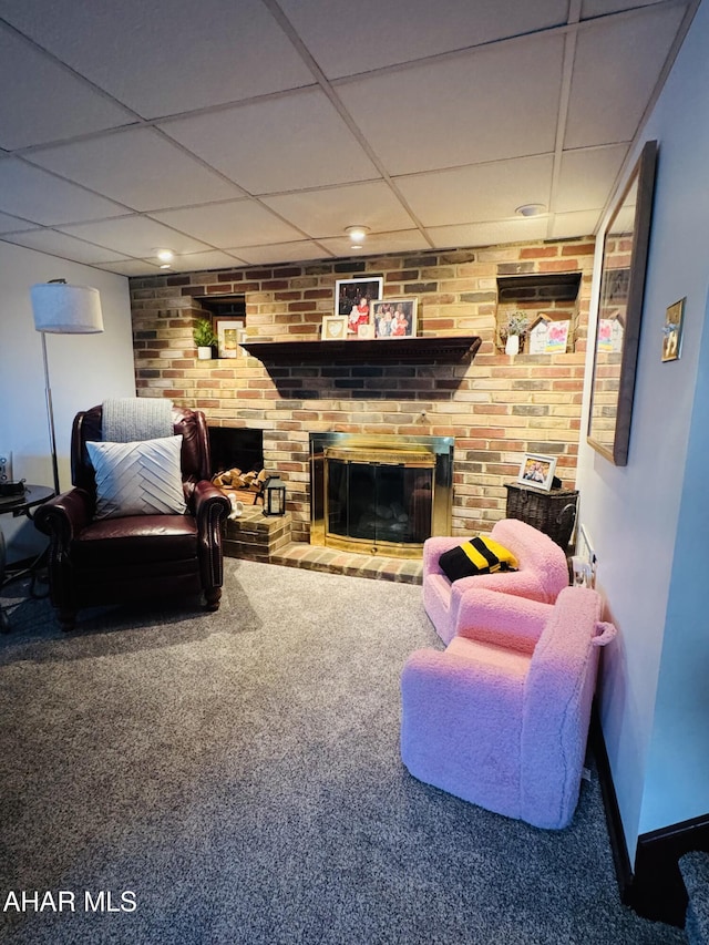 895 Coach Rd, Cresson, PA 16630 - carpeted living area with brick wall, baseboards, a drop ceiling, and a brick fireplace