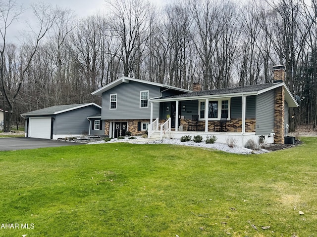 895 Coach Rd, Cresson, PA 16630 - split level home with a porch, a chimney, driveway, and a front yard