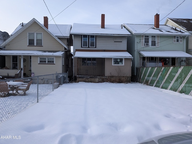 view of snow covered house