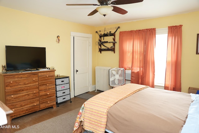 1211 20th St, Altoona, PA 16601 - bedroom with radiator, wood finished floors, and a ceiling fan