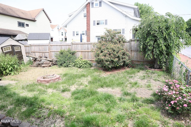 1211 20th St, Altoona, PA 16601 - fenced backyard featuring a fire pit