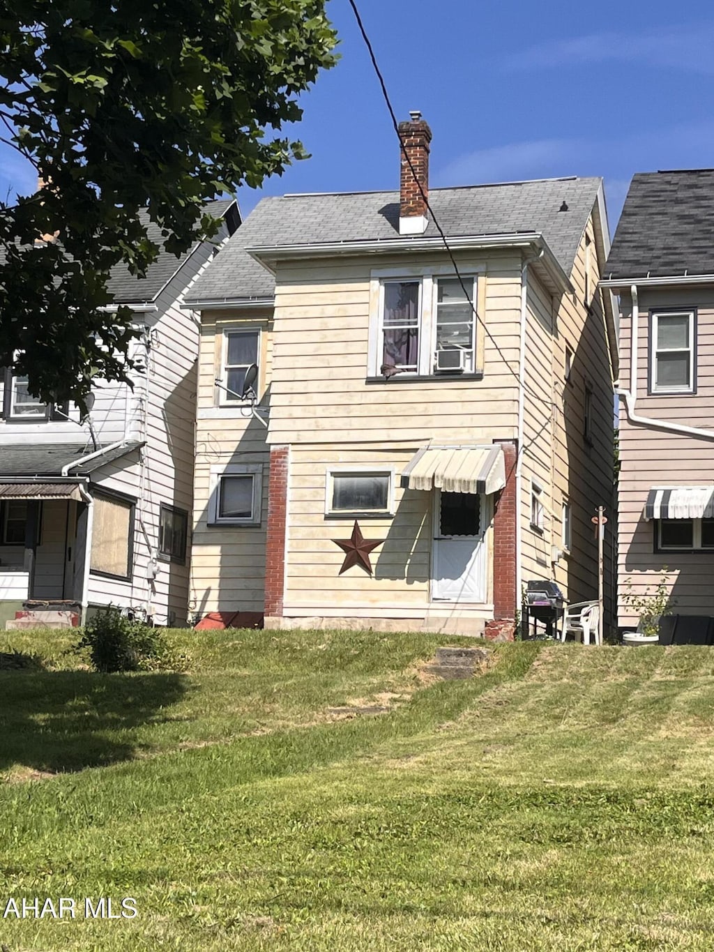 1627 21st Ave, Altoona, PA 16601 - back of house featuring a yard and a chimney