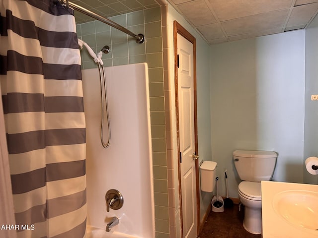 full bathroom with shower / bath combo with shower curtain, vanity, and toilet