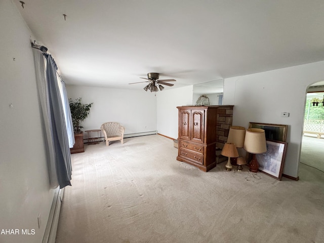 2715 16th St, Altoona, PA 16601 - living area featuring light carpet, a ceiling fan, arched walkways, and a baseboard heating unit