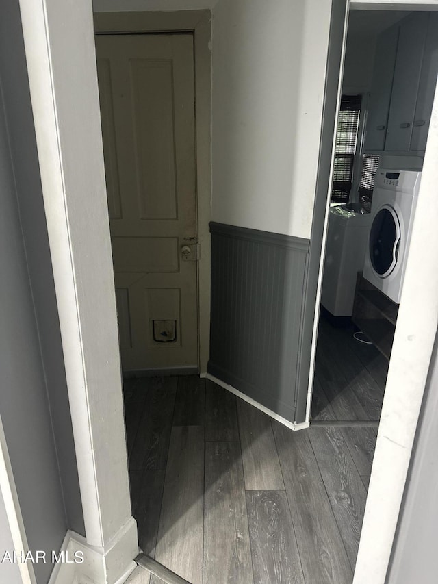 hallway with hardwood / wood-style floors and washer / clothes dryer