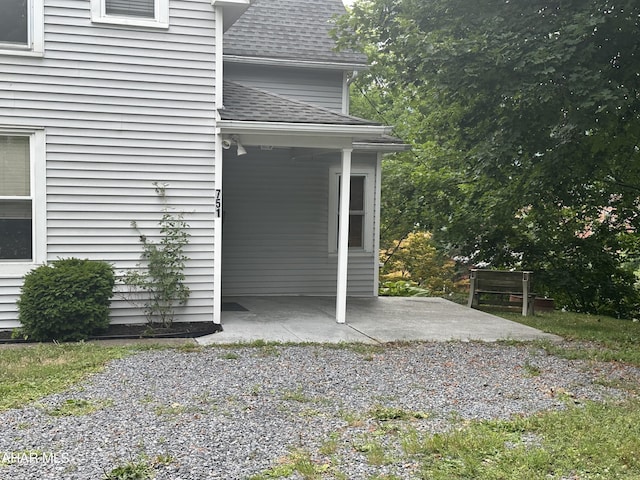 view of side of property with a patio