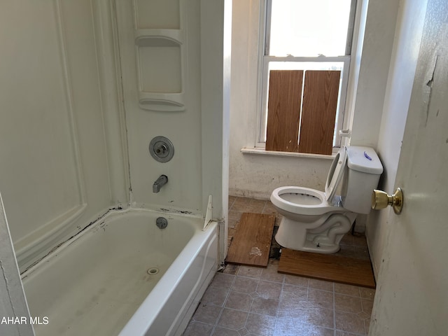 bathroom featuring tile patterned flooring and toilet