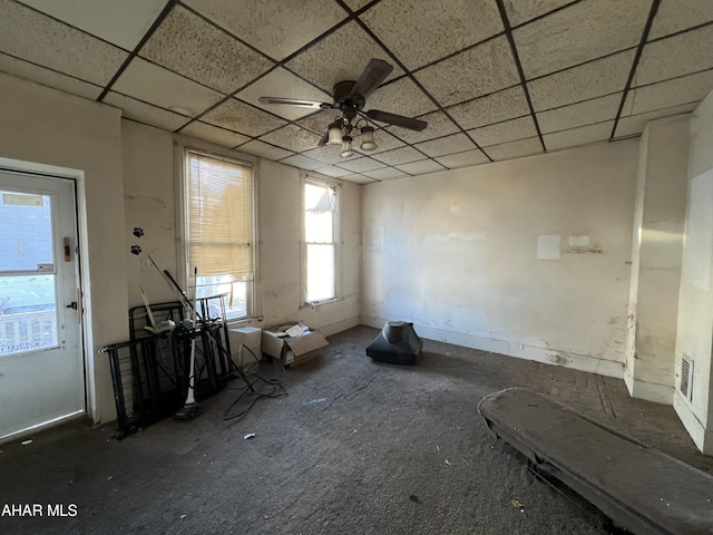 misc room featuring a drop ceiling and ceiling fan