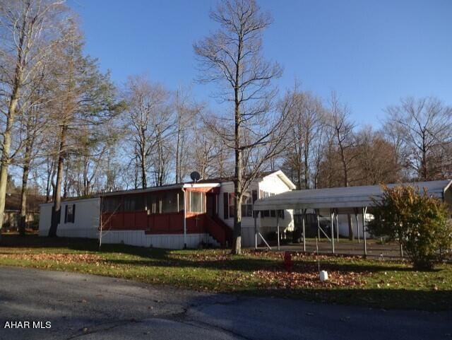 view of front of house with a carport