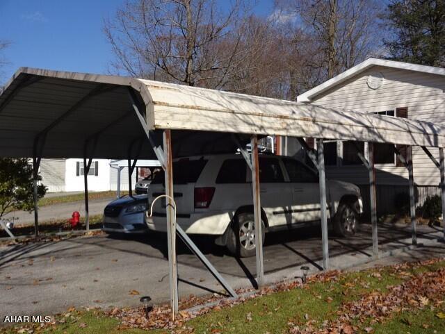 view of parking / parking lot with a carport