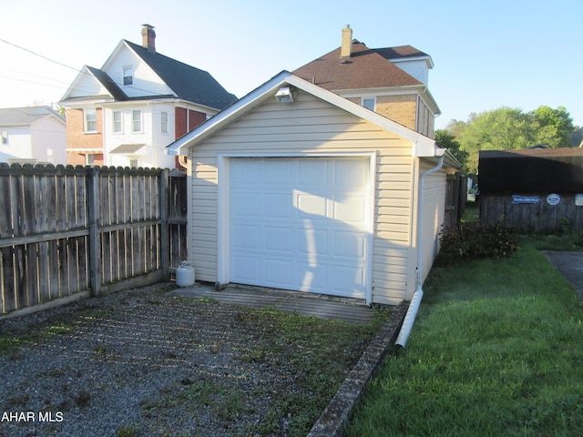 garage featuring a yard