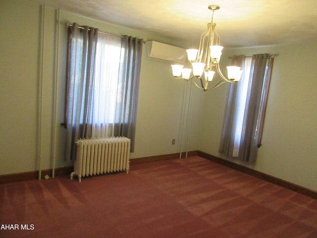 empty room with a chandelier, a wall unit AC, and radiator