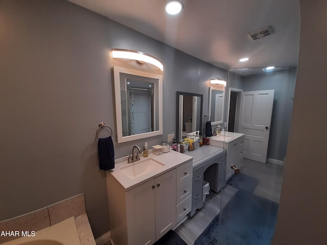 bathroom with vanity and walk in shower