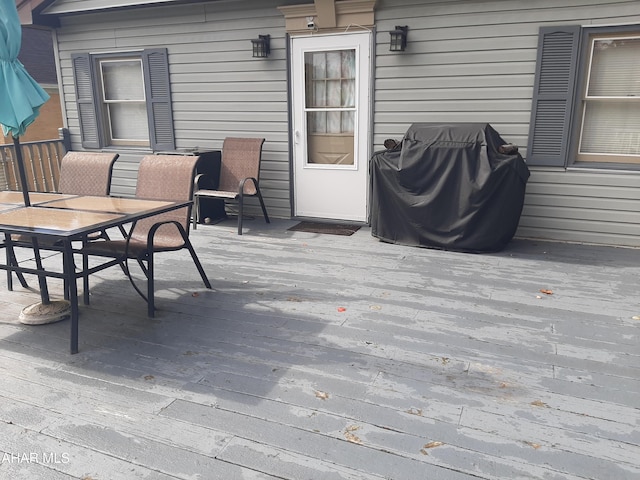 wooden terrace featuring area for grilling