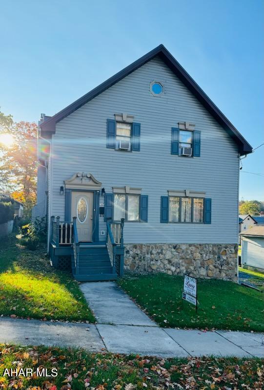 view of front of house featuring cooling unit