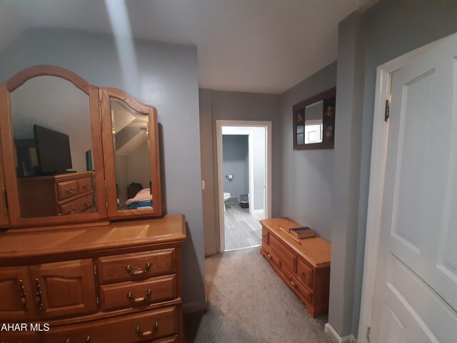 hallway with light colored carpet