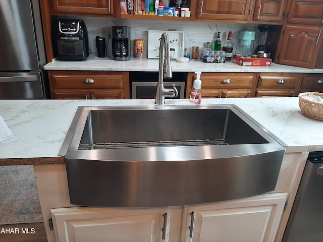 kitchen featuring appliances with stainless steel finishes and sink