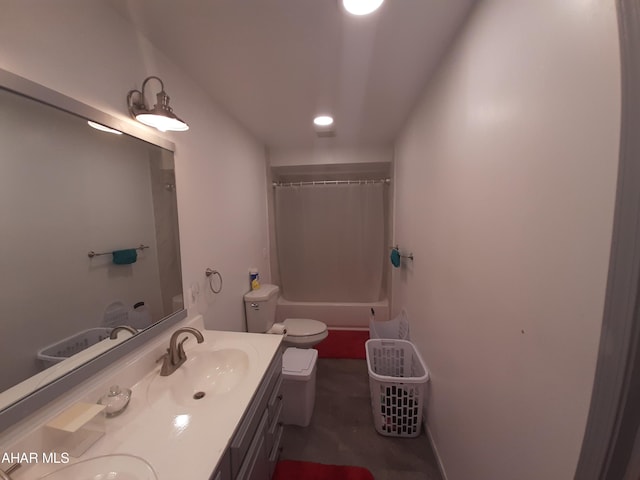 full bathroom featuring shower / bathtub combination with curtain, vanity, and toilet