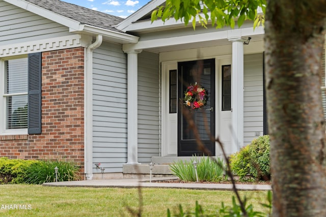 409 Tree Ln, Duncansville, PA 16635 - entrance to property featuring brick siding, covered porch, and a shingled roof