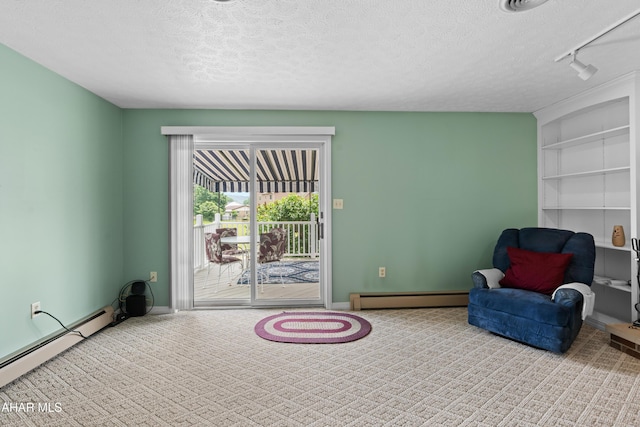 409 Tree Ln, Duncansville, PA 16635 - sitting room featuring baseboard heating, a textured ceiling, carpet, and baseboards