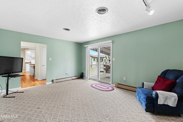 409 Tree Ln, Duncansville, PA 16635 - sitting room with a baseboard radiator, baseboards, carpet flooring, and a textured ceiling