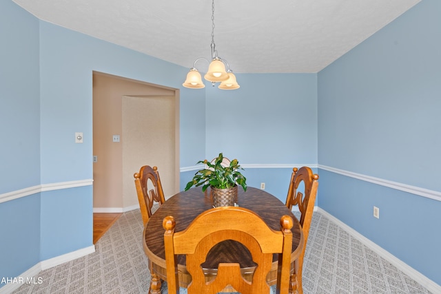 409 Tree Ln, Duncansville, PA 16635 - dining space with a chandelier, carpet floors, and baseboards