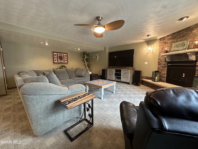 3406 Granada Way, Altoona, PA 16601 - living area featuring carpet, ceiling fan, a stone fireplace, and a textured ceiling