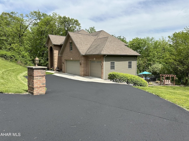 3406 Granada Way, Altoona, PA 16601 - view of front of property with a front yard, brick siding, and a shingled roof