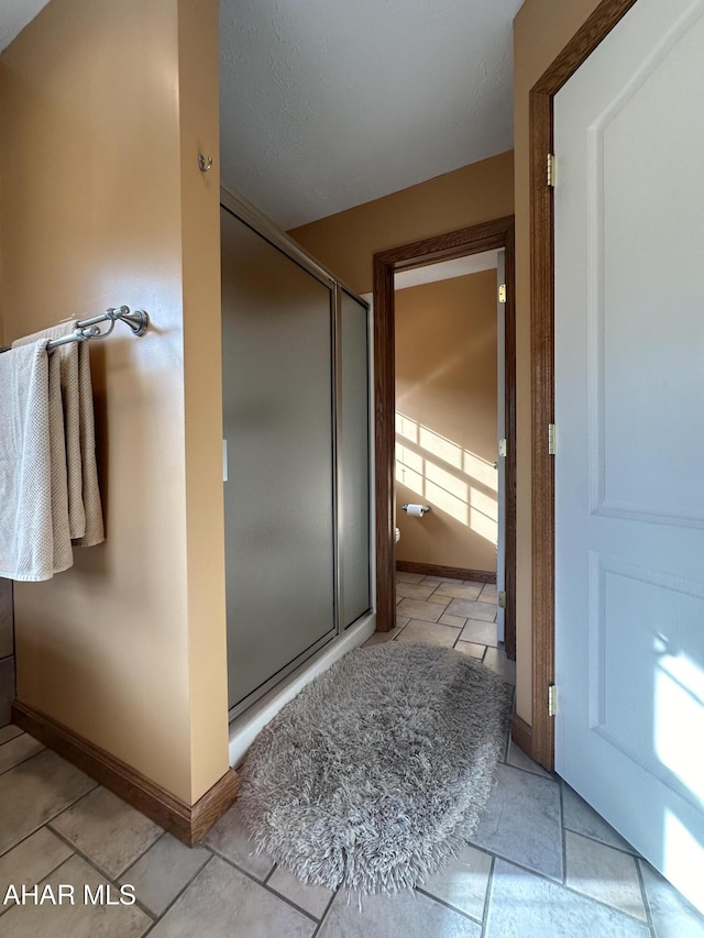 3406 Granada Way, Altoona, PA 16601 - full bathroom with a stall shower, tile patterned flooring, and baseboards