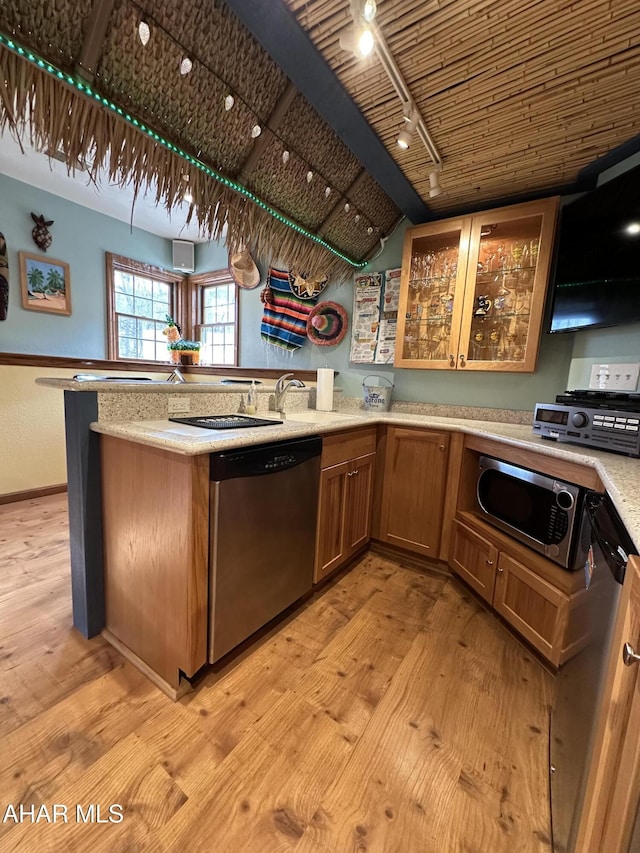 3406 Granada Way, Altoona, PA 16601 - kitchen featuring appliances with stainless steel finishes, rail lighting, light wood-style flooring, a peninsula, and vaulted ceiling