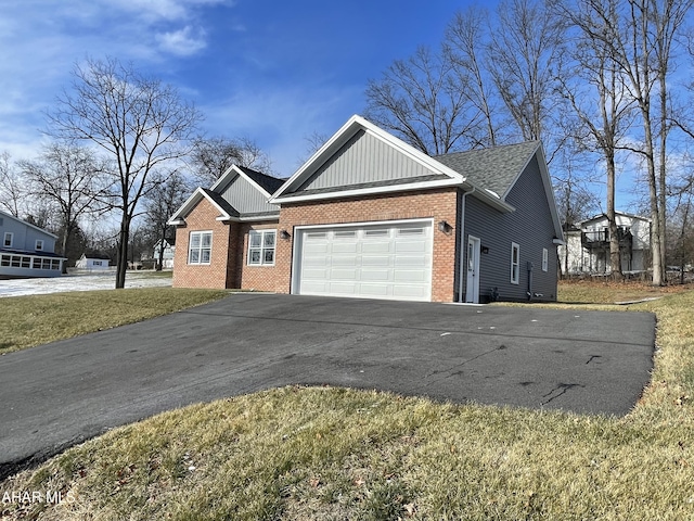 view of home's exterior featuring a garage and a lawn