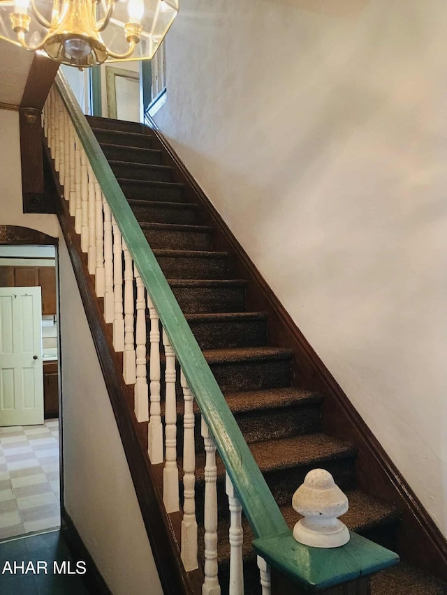 818 5th Ave, Patton, PA 16668 - stairway featuring a chandelier and tile patterned floors