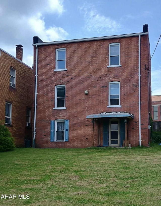818 5th Ave, Patton, PA 16668 - back of house with a yard and brick siding