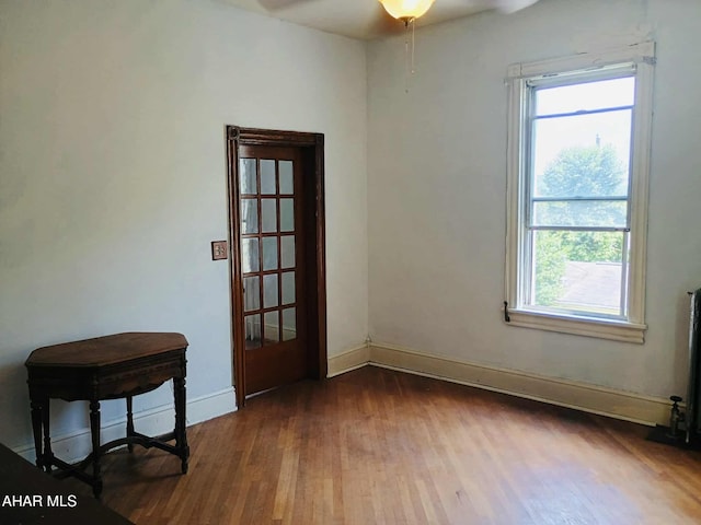 818 5th Ave, Patton, PA 16668 - empty room with wood finished floors, healthy amount of natural light, and a ceiling fan