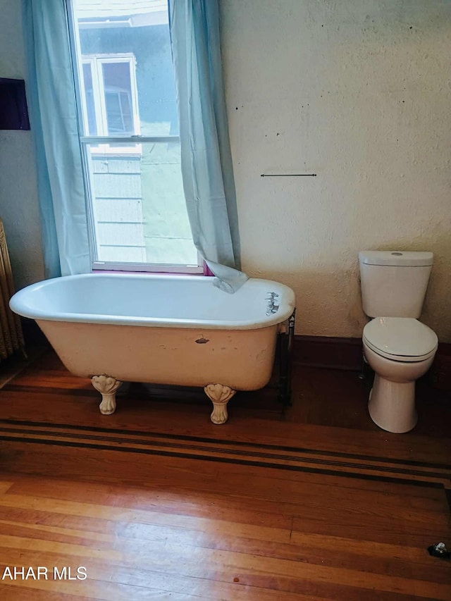 818 5th Ave, Patton, PA 16668 - bathroom with a freestanding tub and wood finished floors