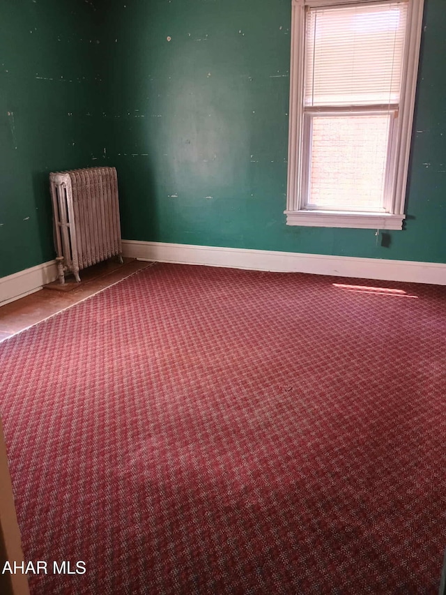 818 5th Ave, Patton, PA 16668 - carpeted spare room with radiator heating unit and baseboards