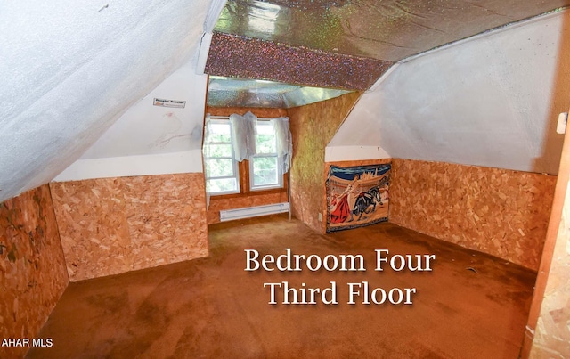 bonus room with a textured ceiling, vaulted ceiling, and baseboard heating