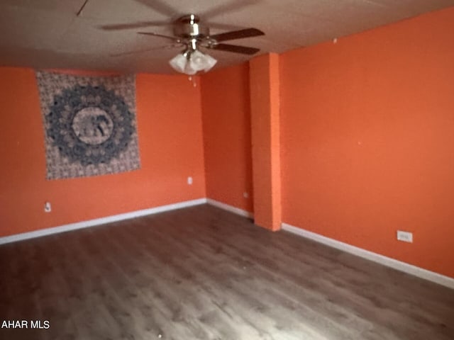 unfurnished room featuring ceiling fan and wood-type flooring