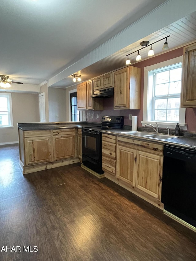 kitchen with kitchen peninsula, ceiling fan, sink, black appliances, and dark hardwood / wood-style floors