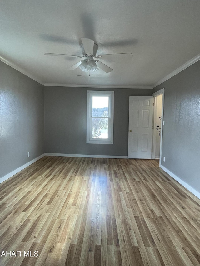 unfurnished room with ceiling fan, light hardwood / wood-style floors, and ornamental molding