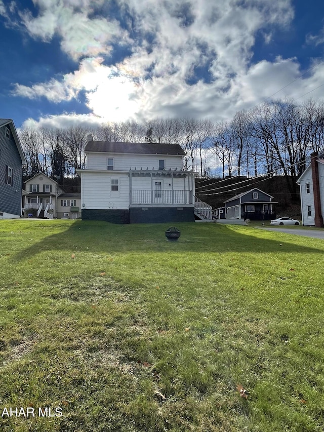 exterior space with a lawn and a deck